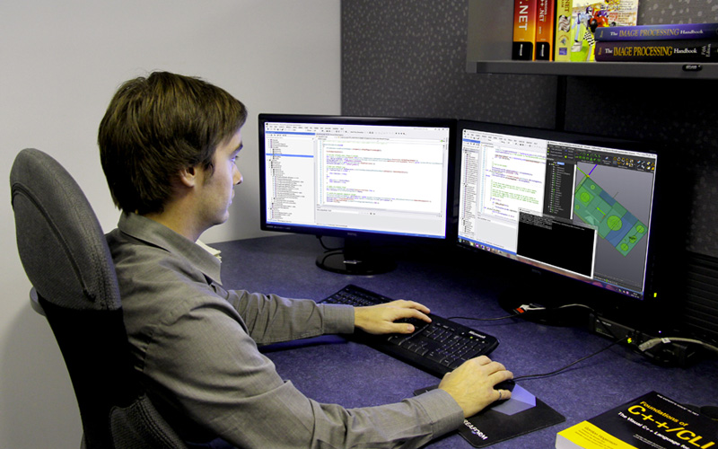 Creaform's employee working on his computer